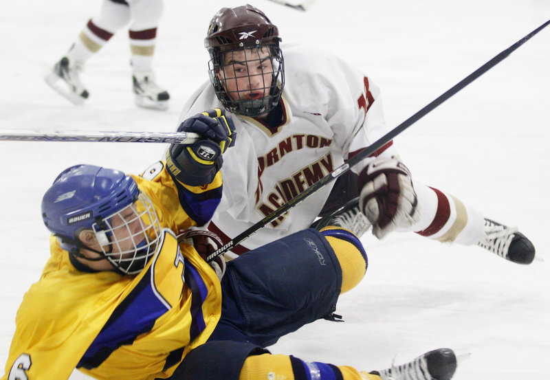 Sam Canales of Thornton Academy lays a check on Andre Clement of Falmouth after Clement got off a shot. Thornton improved to 9-5 with the victory. Falmouth dropped to 6-5-3.