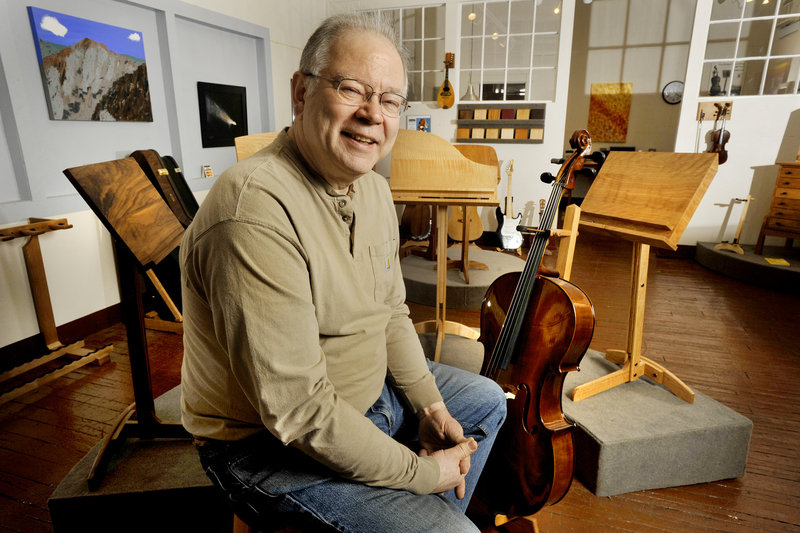 John Stass has found a niche making music room furniture and selling it all over the world. Stass’ custom-designed pieces appeal to professionals who are passionate about a musical hobby and want something other than metal or plastic display racks or cabinets for their instruments and accoutrements.