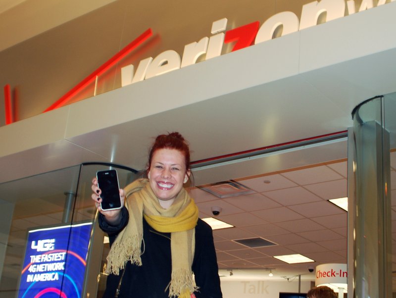 Madison Bratz shows off the iPhone she bought Thursday at West Acres Mall in Fargo, N.D. “I have waited so long for this. So long,” she said.