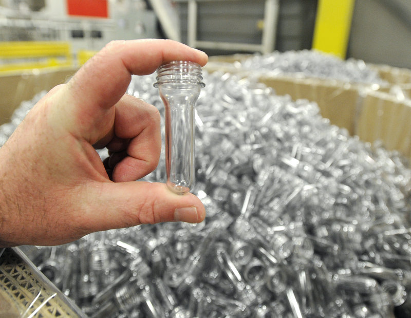 This injected molded plastic tube will be transformed into a 16-ounce bottle at the Poland Spring bottling plant.