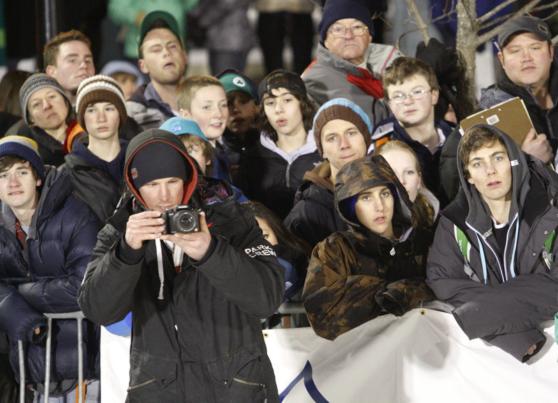 A large crowd braves the cold to watch the winter sports action.
