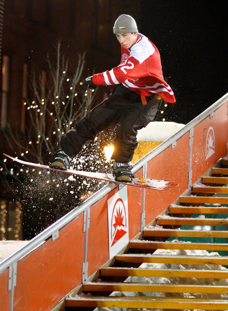 Snowboarder Mike Ravelson of Shrewsbury, Mass., rides a rail during the third annual Downtown Showdown in Monument Square on Friday night. The event drew an estimated 2,000 people.