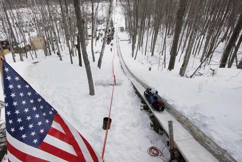 A team makes a trial run during the 21st Annual U.S. National Toboggan Championships in Camden on Saturday. The championships will continue through today.