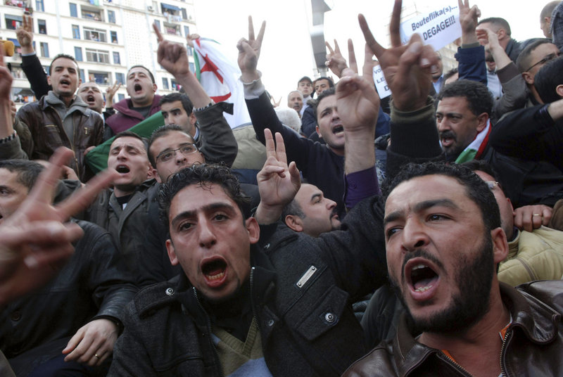 Algerian protesters chant slogans during a demonstration in Algiers, Algeria, on Saturday, despite a ban on protests.