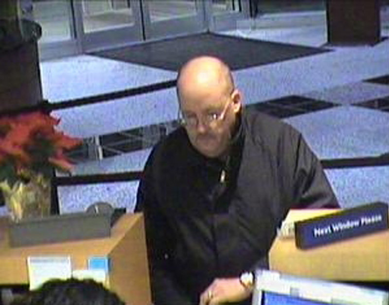 This image, taken from surveillance video provided by the U.S. Attorney s Office for the Eastern District of Virginia, shows a suspect dubbed the "Granddad Bandit" robbing a bank in Virginia in December 2008.