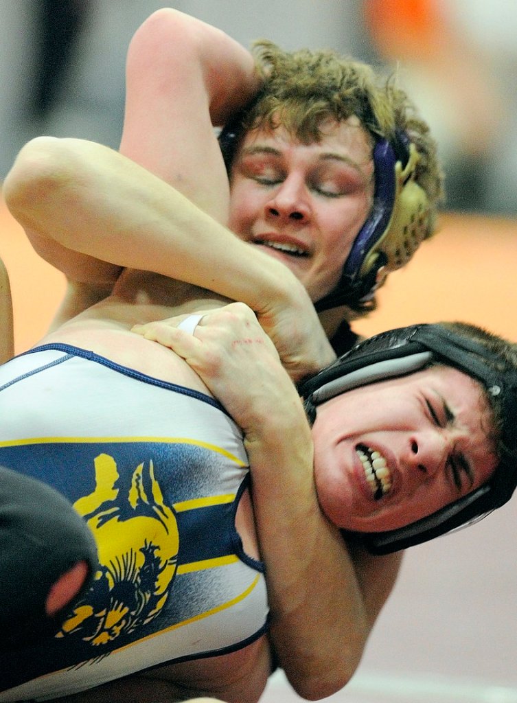 William Bellottie, top, of Marshwood and Kevin Moore of Mt. Blue compete Saturday in a 125-pound semifinal during the Class A wrestling championships at the Augusta Civic Center. Bellottie won, 13-4.