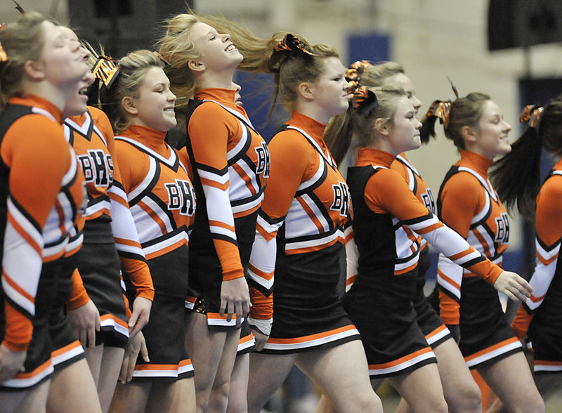 The Biddeford High cheerleaders go through their routine Saturday during the state championships at the Bangor Auditorium. Biddeford, which won the past three state titles, finished third behind Lewiston, which set a state record with 168.5 points, and Marshwood.