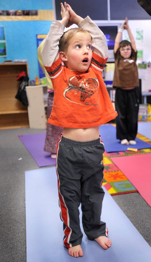 Student Jonathan Bouchard participates in a yoga class at Riverton School as part of an enrichment program. In March, students will present projects done during the program.