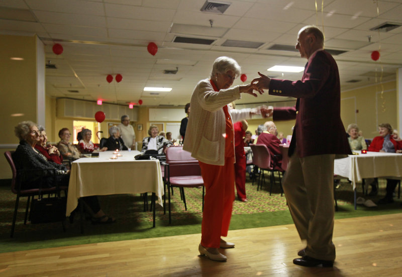 Hewitt Bruce dances with Betty Fisch at Edgewater Pointe Estates in Boca Raton, Fla. Women often so outnumber men in retirement communities that Valentine’s Day can be a lonely time. A solution to the perennial shortage of men at dances: importing them.