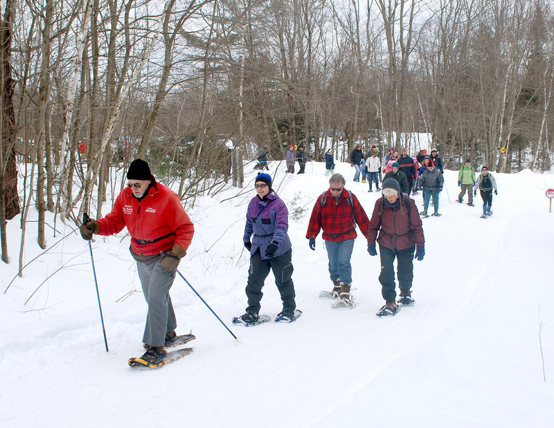 Don Robitaille of Lewiston leads a group of snowshoers during a hike at Androscoggin Riverlands State Park in Turner. A group of nearly 60 showed up for the first hike in the series, which continues Saturday.