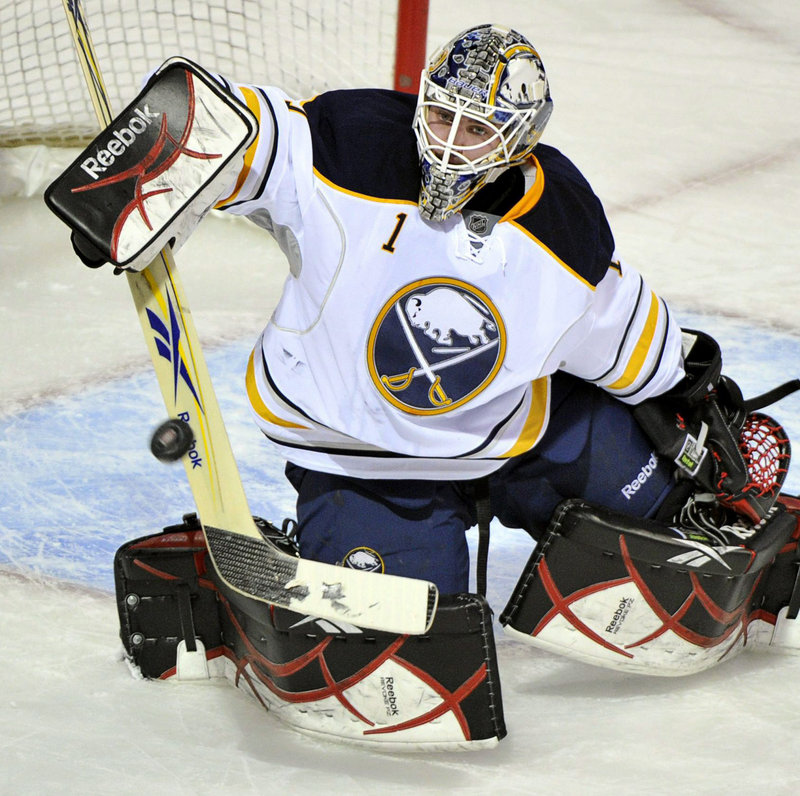 Jhonas Enroth, recalled from the Portland Pirates for the third time this season by Buffalo, makes one of his 32 saves as the Sabres beat Montreal in a shootout.