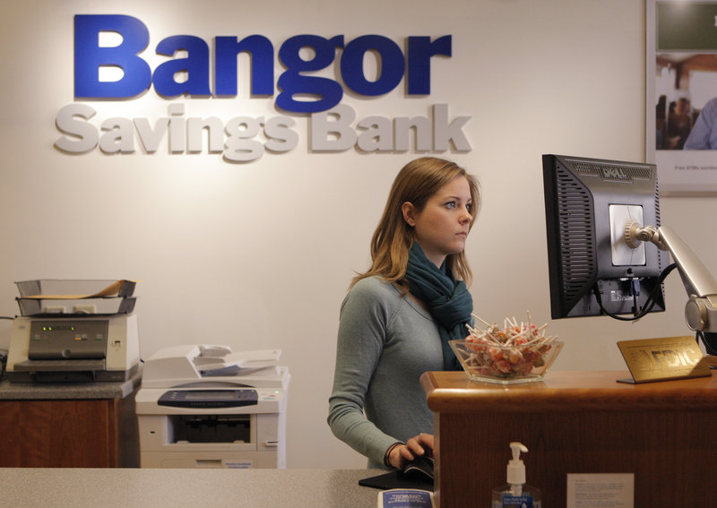 Megan Krispin works at Bangor Savings Bank in the Old Port earlier this month. She was hired when the branch opened in July as part of a $4 million expansion in southern Maine.