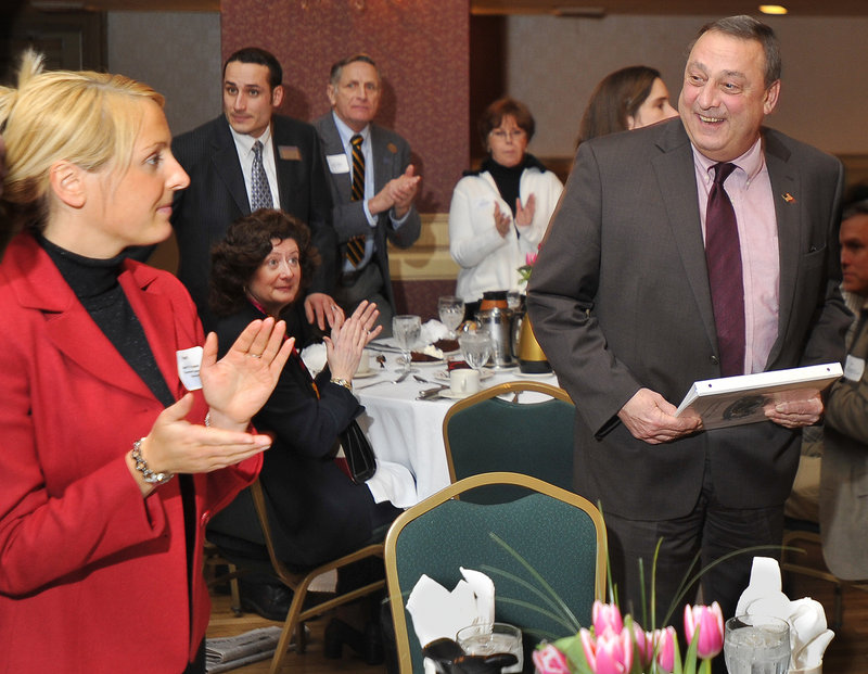 Gov. Paul LePage is greeted by a standing ovation at the Portland Regional Chamber’s luncheon at the Eastland Hotel on Friday.