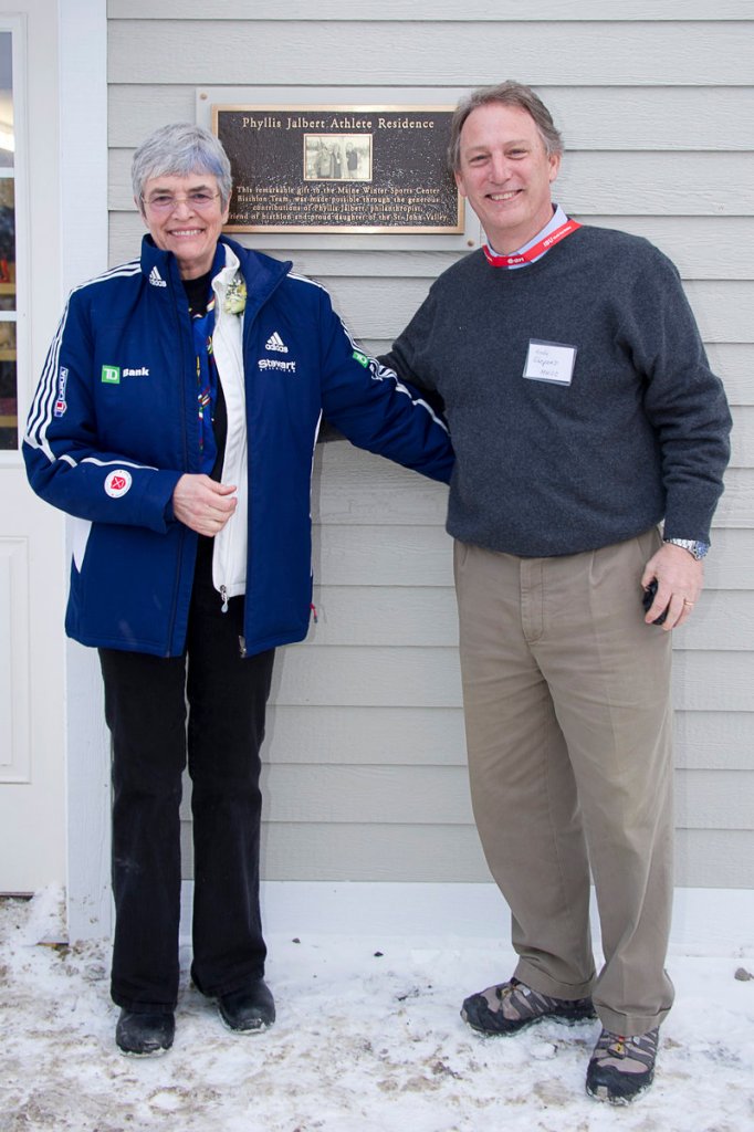 Phyllis Jalbert and Andy Shepard show off the Phyllis Jalbert Athlete Residence, which already houses two biathletes on the Maine Winter Sports Center team.