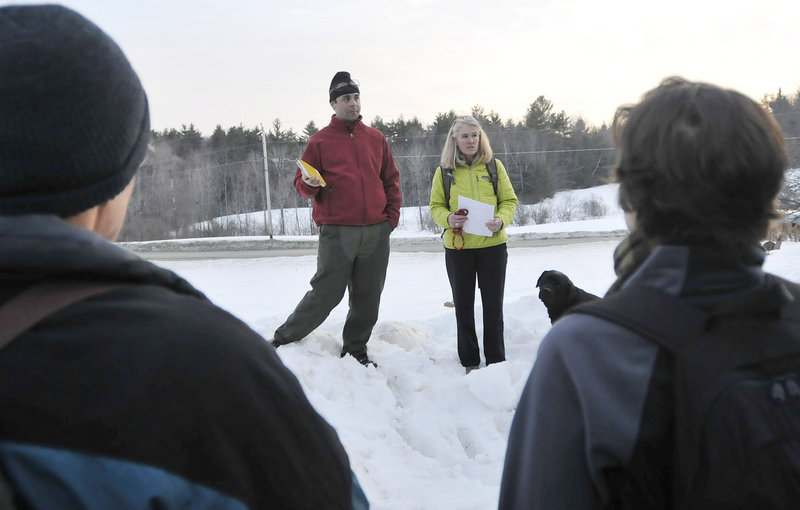 Kyle Warren, stewardship coordinator, and Eugenie Francine, vice president of the Royal River Conservation Trust, talk to the hikers about their organization.