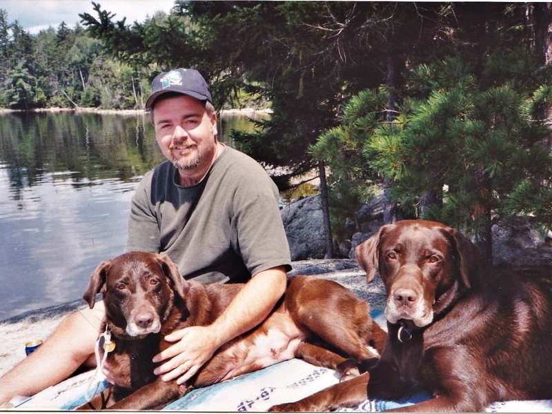 Steven Loignon appears in photo with his two chocolate Labs. Mr. Loignon, a longtime Shapleigh resident, died Wednesday at age 47. Family photo