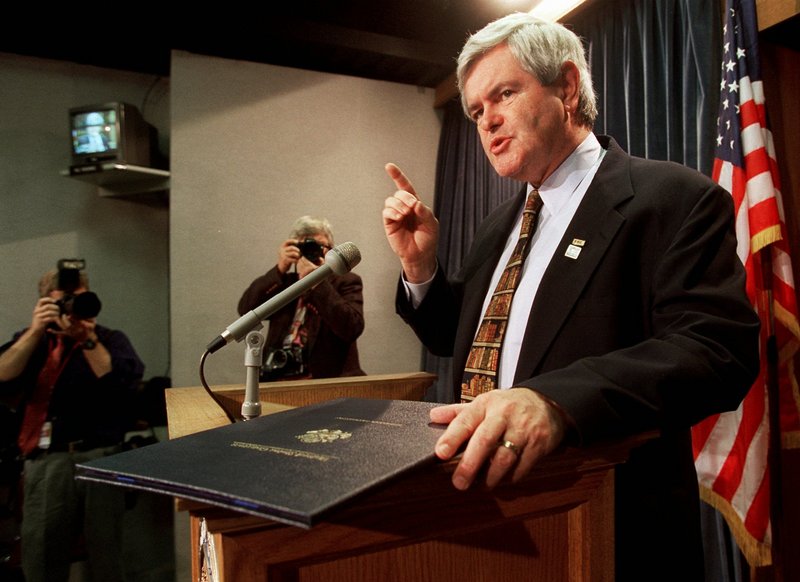 In a 1995 file photo, House Speaker Newt Gingrich, R-Ga., talks to reporters after signing a continuing resolution during the government shutdown in 1995-96. Observers say the GOP’s image suffered greatly as a result of that political battle, and many vow to avoid a shutdown over budget cuts in 2011.