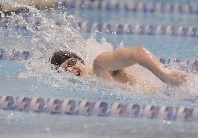Greely’s Dan Spencer powers through the 100-yard freestyle in the preliminaries on Monday at Wallace Pool in Orono. The Rangers won the state title with 396 points.