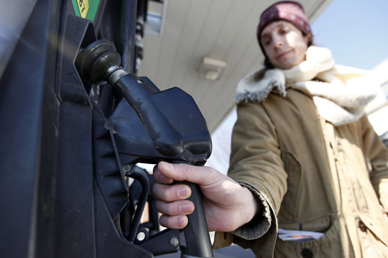 David Castro-Diephouse returns the nozzle to the pump after filling his car's tank with gas last week in Philadelphia. Gas prices reached a 28-month high last Wednesday amid escalating violence in the Middle East, even though oil and gas supplies in the United States continue to grow and demand for gas is weak.