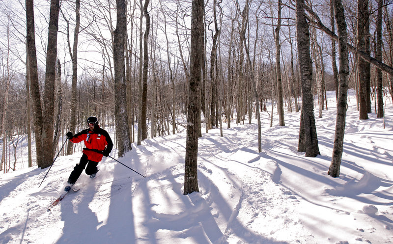 Jeff Kuller, director of Camden Snow Bowl, skis one of the mountain’s glades earlier this month.