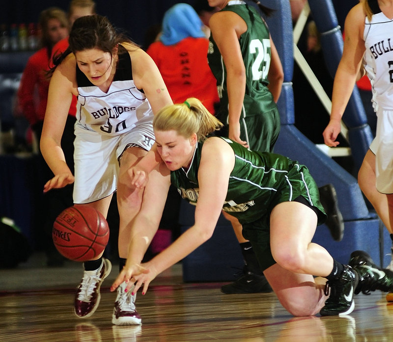 Wendy Goldman, left, of Hall-Dale and Kennadi Grover of Georges Valley dive for a loose ball during Hall-Dale s 59-30 victory in a Western Class C quarterfinal.