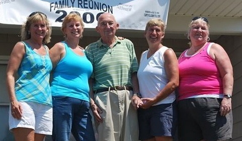 Donald Erickson spends time at a family reunion last July in Cape Elizabeth with, from left, daughter Patricia Erickson, Deb Rubino, Kathy Erickson and Sue Carver.