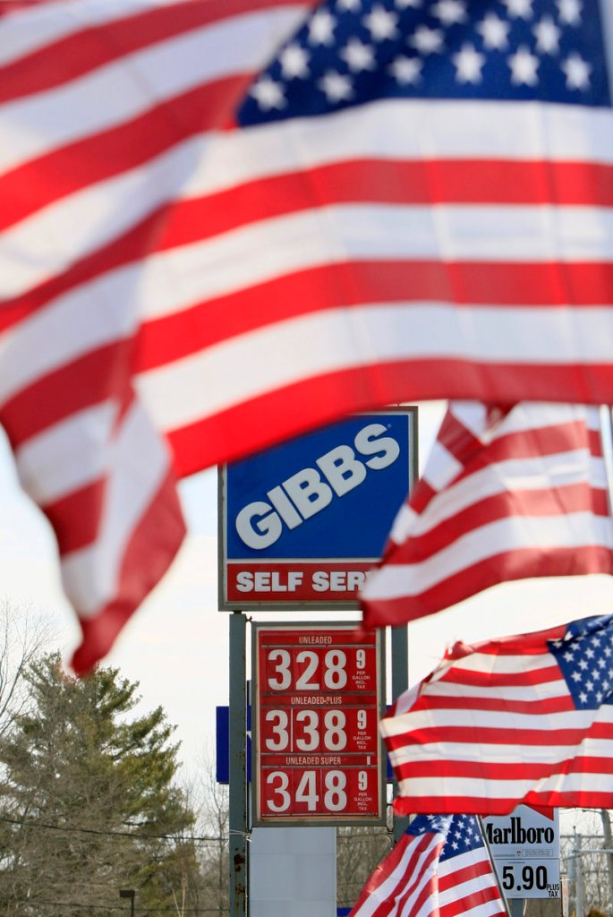 A Gibbs gas station in Topsham reflects the climbing price of gasoline on Thursday. Upheaval in the Middle East and uncertainty in the oil industry has led to higher costs for the fuel than any point since 2008, despite ample supplies.