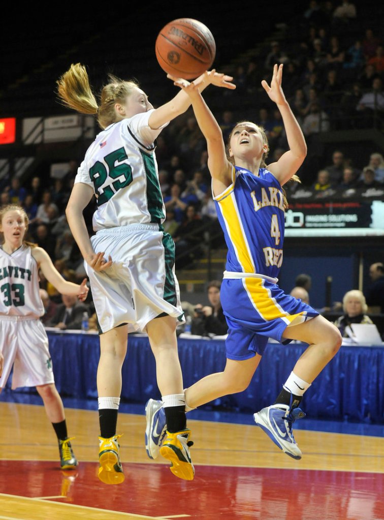 Sydney Hancock of Lake Region eludes Kristen Anderson of Leavitt to get off a shot. Leavitt won 62-35 and will meet York in a game between unbeatens for the regional title.