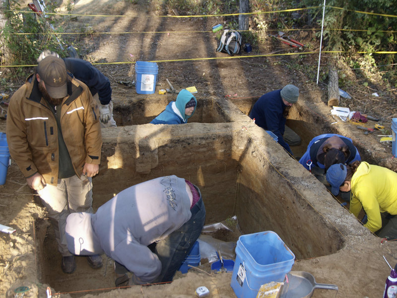 The journal Science provided this August 2010 photo of archaeologists working at the site in Alaska that has turned up some of the oldest human remains found in North America. The archaeologists have pieced together a dramatic story of a child who was cremated before the site was abandoned.