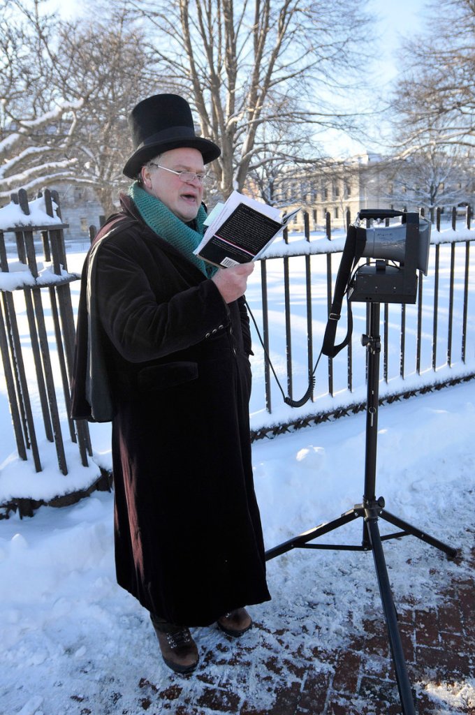 Daniel Noel reads from Longfellow’s works at the start of the Longfellow February Frostbite 2.5 K Road Race on Saturday.