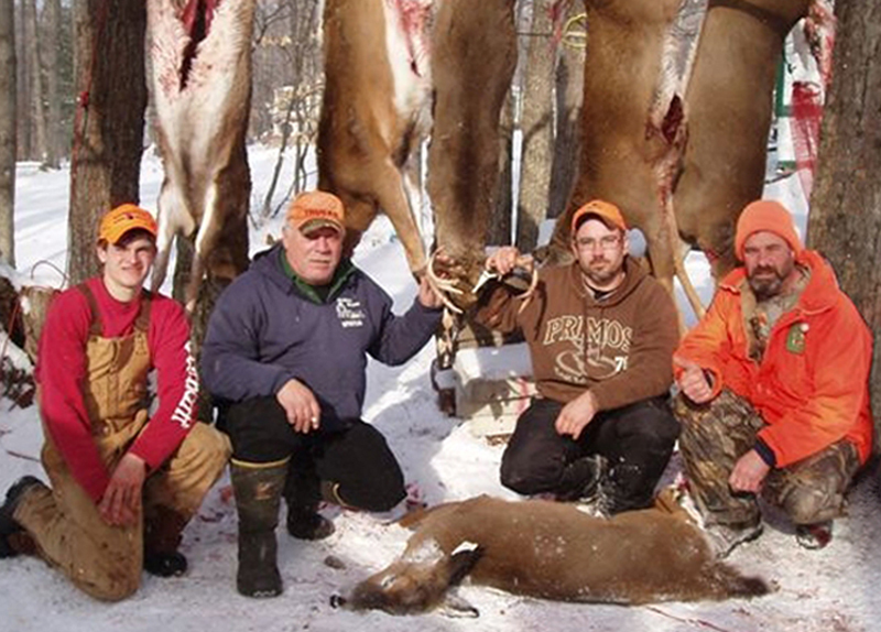 Charged with a number of hunting violations in Maine and Pennsylvania are, from left, Carlton Enos, Everett H. "Lenny" Leonard and Everett T. Leonard, all of Turner, and Lucien H. Clavet of Monmouth.