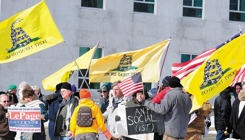 Counter-protesters assemble between the Burton M. Cross State Office Building and the State House on Saturday to show support for Gov. Paul LePage and Wisconsin Gov. Scott Walker, who are both Republicans.