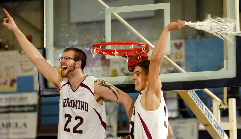Kyle O’Brien, left, and Wade Tuttle get their turns cutting down the nets for Richmond, which beat Vinalhaven 55-52 at the Augusta Civic Center to win the Western Class D title for the fourth consecutive season.