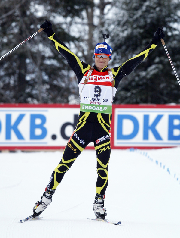 Alexis Boeuf of France celebrates his victory in the men’s 12.5K pursuit at the World Cup biathlon event Sunday. Boeuf finished in 36:02.4 for his first World Cup win.
