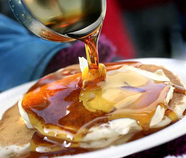Farms across the state open their doors to the public this Sunday for the traditional annual celebration of all things maple, from syrup samplings to sap boiling demonstrations to mouthwatering pancake breakfasts, such as the one pictured here at Cole Farm in Dayton in this photo from 2010.