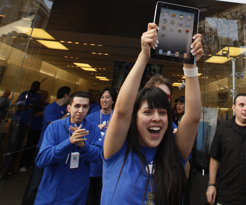 Apple employees cheer as the iPad 2 goes on sale at The Grove Apple store in Los Angeles on Friday. The iPad 2 is the updated version of Apple Inc.'s iPad tablet computer.