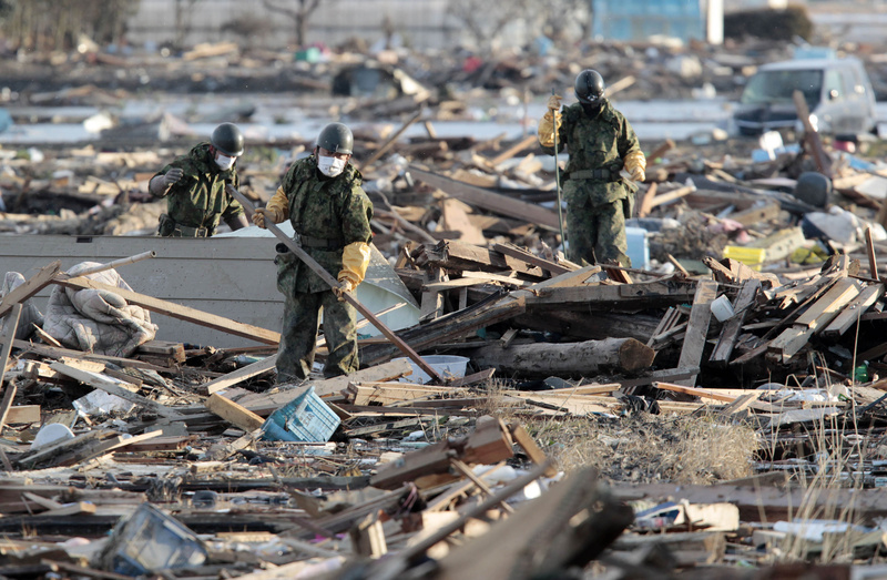 Japan Ground Self-Defense Force personnel search the rubble in the aftermath of the March 11 earthquake-triggered tsunami at Natori, Miyagi Prefecture, Japan, on Wednesday. 9.0 Magnitude Earthquake,Destruction,Devastation,Disaster,Earthquake,people,person,Ruin,Sendai Earthquake and Tsunami