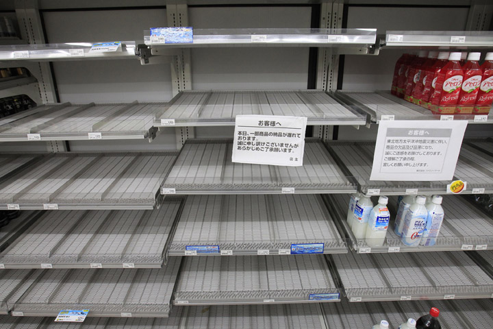 Shelves selling bottled water are empty at a convenience store in Tokyo today. A spike in radiation levels in Tokyo tap water have spurred new fears about food safety as rising black smoke forced another evacuation of workers trying to stabilize Japan's radiation-leaking nuclear plant. 9.0 Magnitude Earthquake; Destruction; Devastation; Disaster; Ea