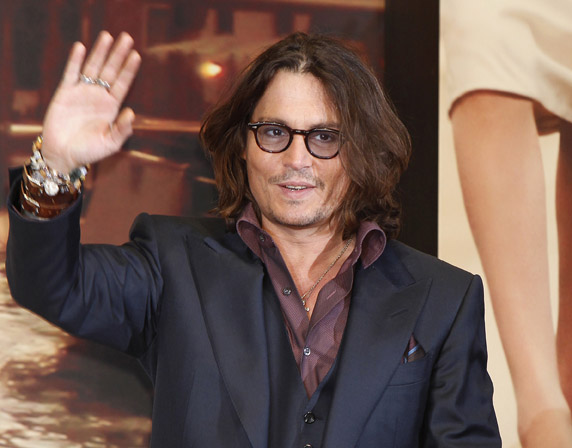 Johnny Depp waves to fans recently in Tokyo.