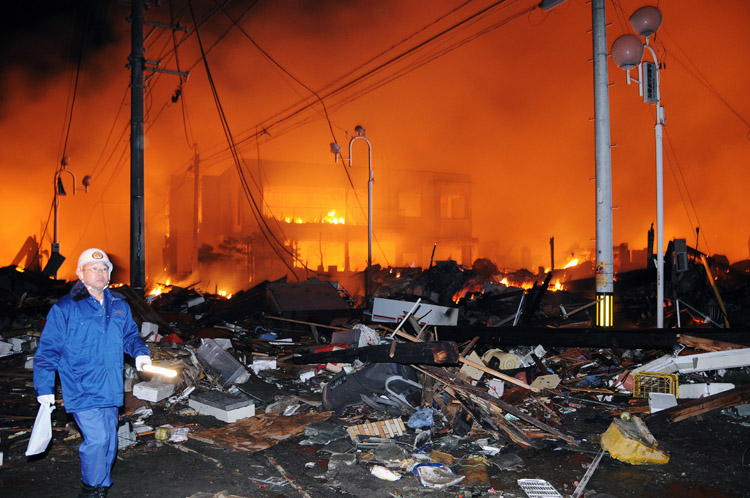 A building burns in Iwaki city, Fukushima prefecture, Japan, after the quake hit today.