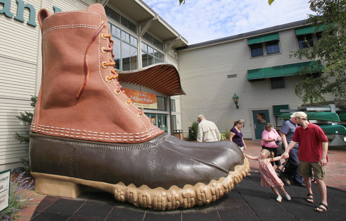 Shoppers pause at the giant boot outside the L.L. Bean flagship store in Freeport in this 2009 photo.