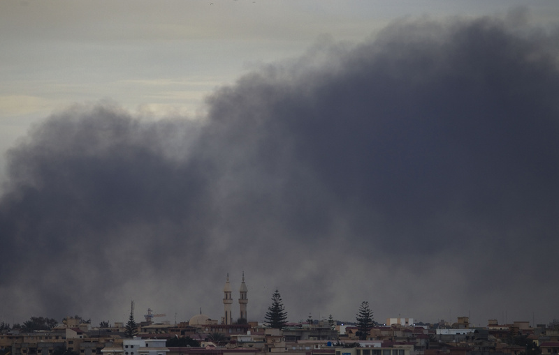 Smoke obscures the sky on the outskirts of Benghazi, Libya, on Saturday.