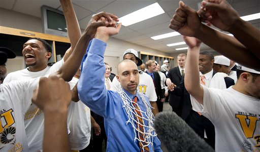 In this photo provided by Virginia Commonwealth, VCU head coach Shaka Smart, center, celebrates with his team after winning the Southwest regional final game against Kansas in the NCAA college basketball tournament on Sunday, March 27, 2011, in San Antonio. VCU won 71-61. (AP Photo/Virginia Commonwealth, Scott K. Brown)