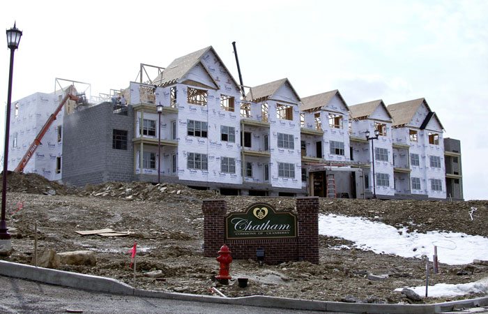 Construction continues recently on a row of condominiums in Cranberry, Pa. Sales of new homes have plunged to a record low, a dismal sign for an already-weak housing market.