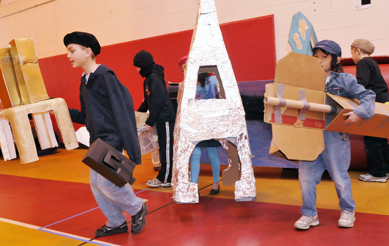 Students from Village Elementary School in Gorham – including Dawson Smith, 9, left, and Kiera Emerson, 8, right – bring out their props during Extreme Mouse Mobiles.