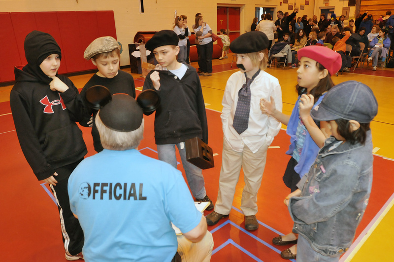 Students from Village Elementary School in Gorham listen to judge Mike Harris of Biddeford before competing in Extreme Mouse Mobiles. From left are Simon Roussel, 10, Andrew Sharp, 9, Dawson Smith, 9, Trevor Gava, 9, Jade Wu, 8, and Kiera Emerson, 8.