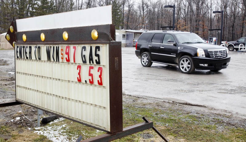 A motorist leaves a service station in New York where gasoline was selling for $3.53 per gallon today.