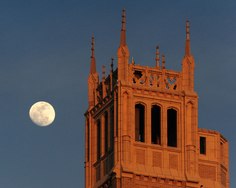 The moon rises above the Jackson Building in Asheville, N.C., on Thursday. A so-called “supermoon” rises tonight.