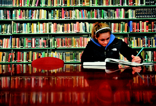 Thomas College sophomore Brianna Moore studies in the college library recently. The Harold Alfond Foundation announced today that it would pledge $5 million toward the college to help build a new academic center on campus with a new library, classrooms and more.