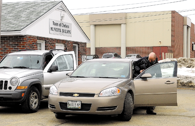 Investigators get into vehicles with boxes of impounded town records this morning at the Chelsea Town Office. Chelsea Selectman Mike Pushard and town attorney Steve Langsdorf said FBI agents were impounding the records.